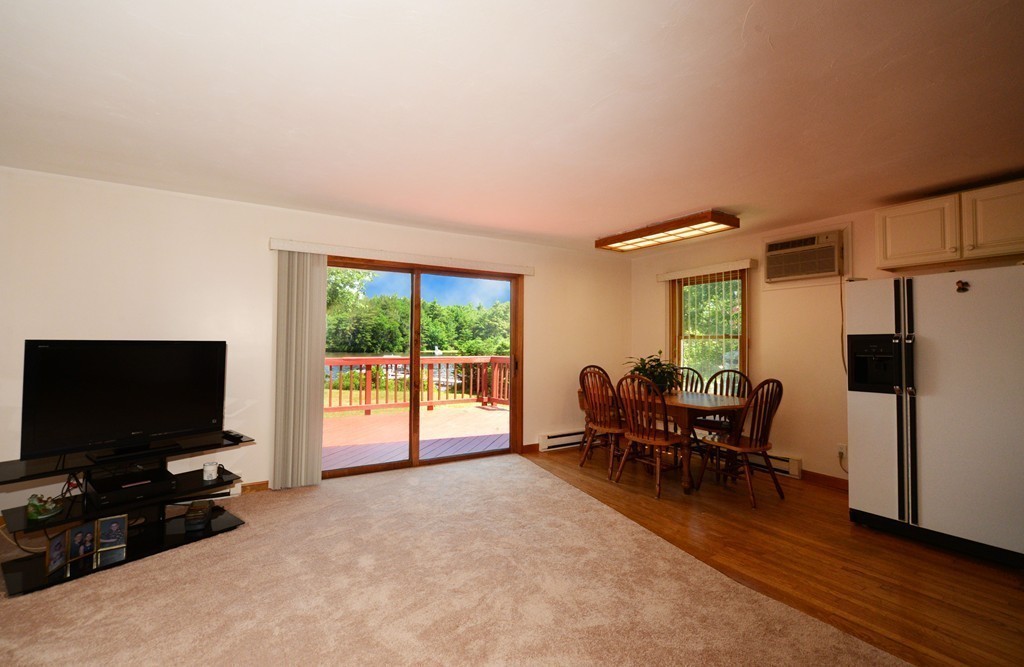 124 Sherbert Road Ashburnham, MA 01430 - Photo 6 of 27 a living room with furniture and a flat screen tv