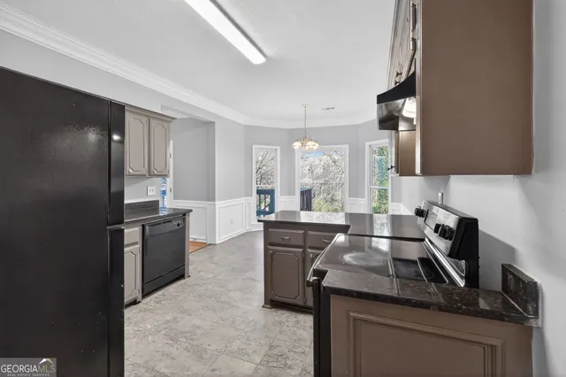 a kitchen with a sink stove and refrigerator