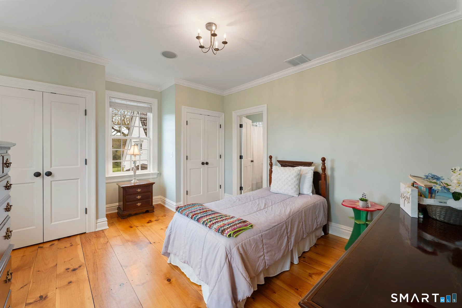 155 Paine Road Woodstock, CT 06281 - Photo 27 of 40 a bedroom with a bed and a view of en suite bathroom