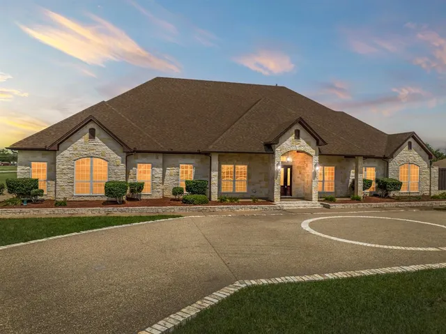 a view of a house with a yard and garage