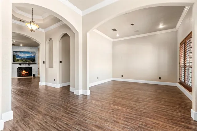 a view of a livingroom with wooden floor
