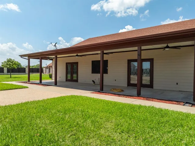 a kitchen with a refrigerator stove top oven and sink