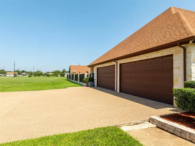 a view of backyard with garage
