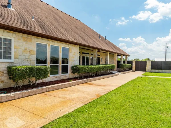 a front view of a house with garden