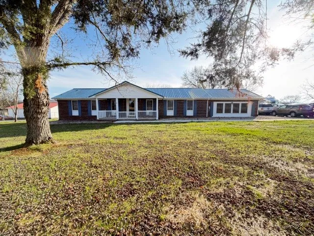 front view of a house with a big yard