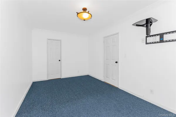 a view of a room with a window and storage
