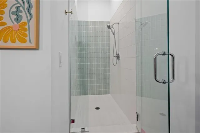 a bedroom with a bed a couch and a window