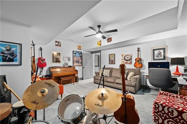 a bedroom with a bed and a table with wooden floor