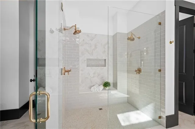 a view of a hallway with wooden floor and a dining room