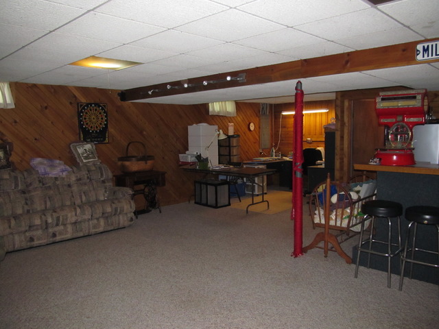 83 North 43rd Road Mendota, IL 61342 - Photo 21 of 25 a living room with furniture and a flat screen tv