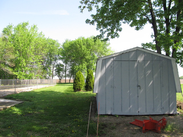 83 North 43rd Road Mendota, IL 61342 - Photo 23 of 25 a view of backyard with wooden fence and trees