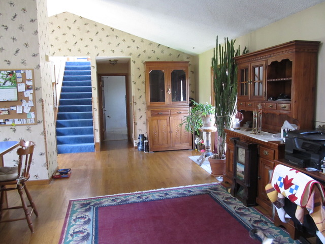 83 North 43rd Road Mendota, IL 61342 - Photo 6 of 25 a living room with furniture and a fireplace