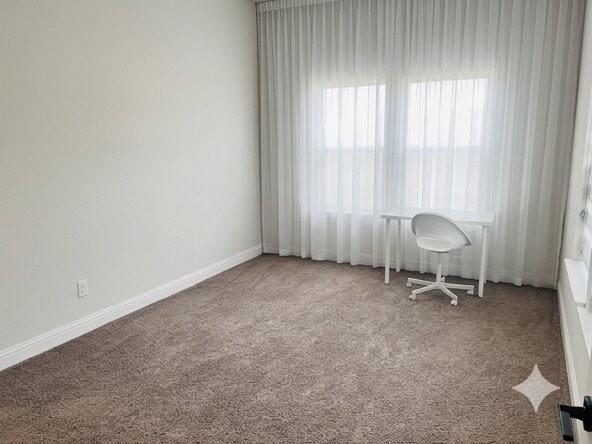 6825 Entwistle Road Frisco, TX 75034 - Photo 15 of 25 This room features wall-to-wall carpeting and white walls, creating a neutral and inviting space