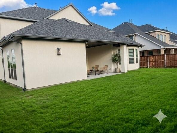 6825 Entwistle Road Frisco, TX 75034 - Photo 24 of 25 This property features an expansive green lawn and a covered patio area, ideal for outdoor enjoyment