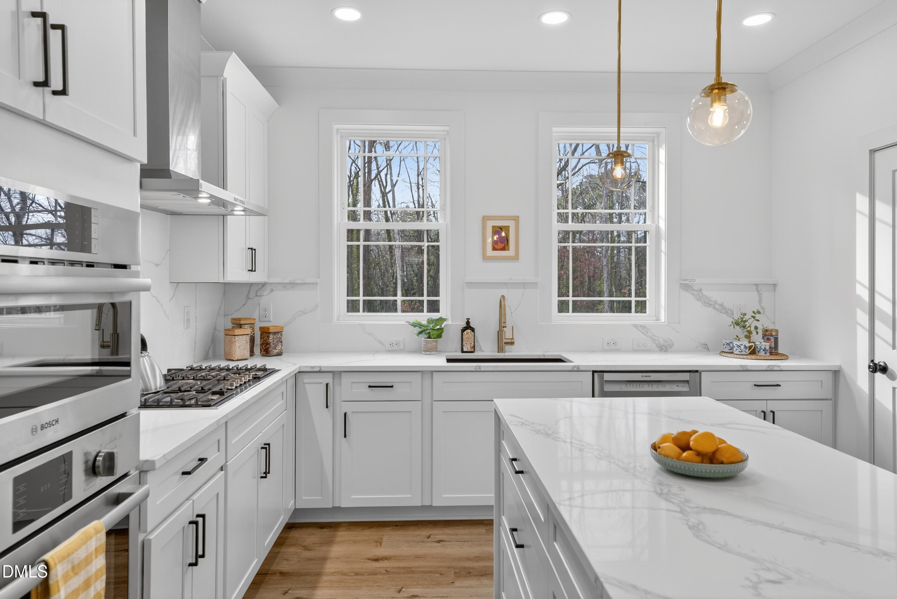 a kitchen that has a lot of cabinets in it