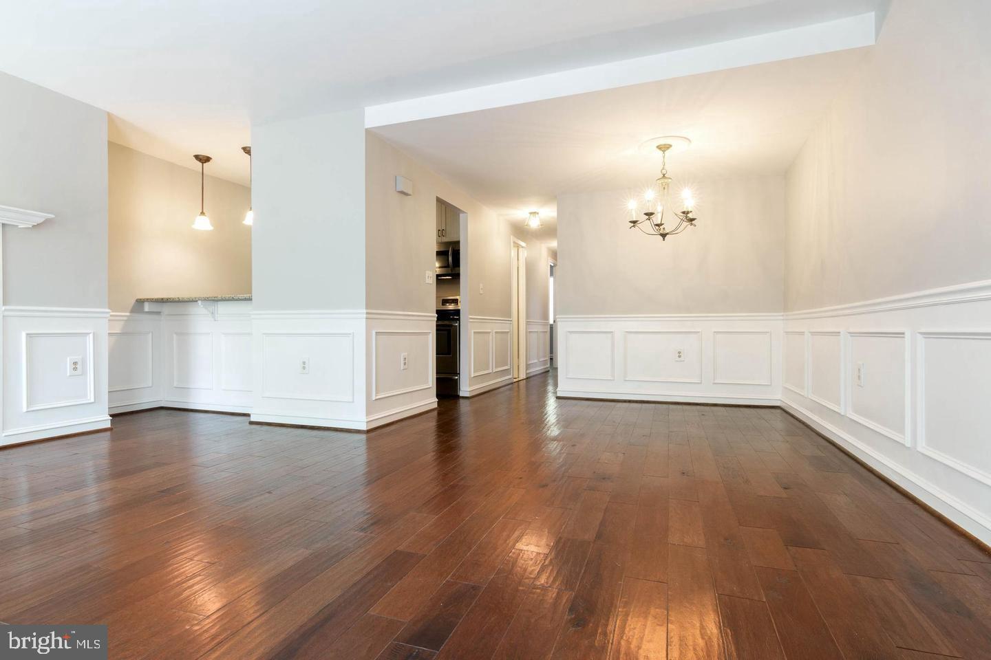 16 Andrew Place Baltimore, MD 21201 - Photo 4 of 17 a view of an empty room and wooden floor