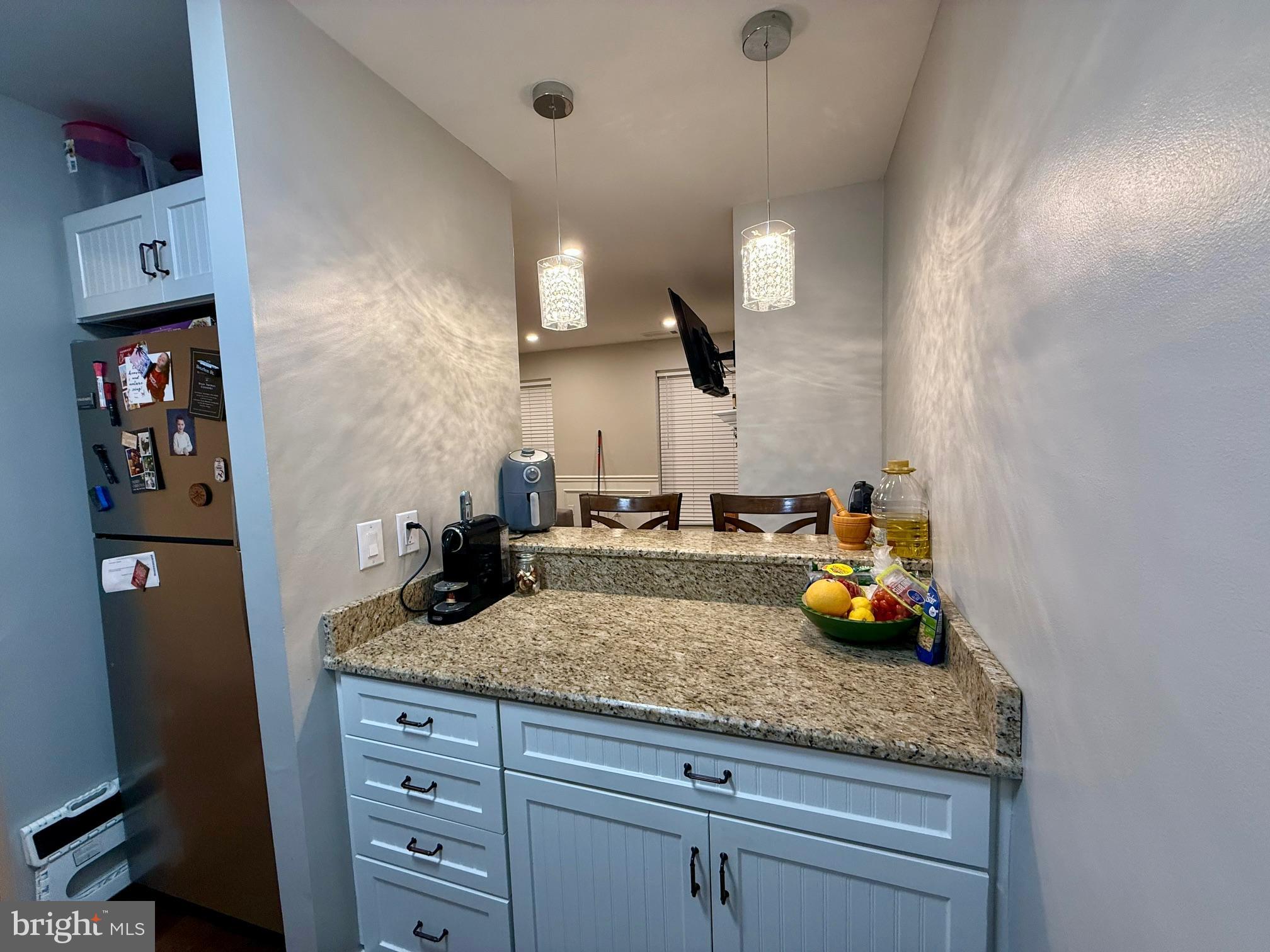 16 Andrew Place Baltimore, MD 21201 - Photo 7 of 17 a kitchen with a sink a counter space and stainless steel appliances