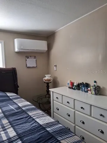 a bedroom with a bed and cabinets