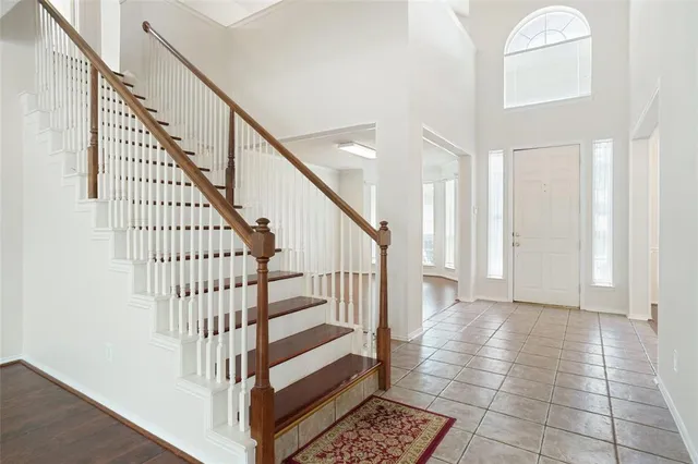 a view of entryway with wooden floor and stairs