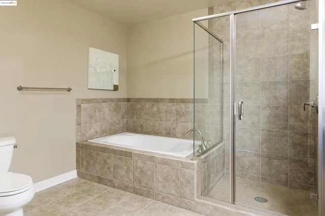 a kitchen with stainless steel appliances granite countertop a stove and a refrigerator