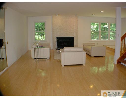 4507 Stonehedge Road Edison, NJ 08820 - Photo 2 of 10 a living room with furniture and a flat screen tv