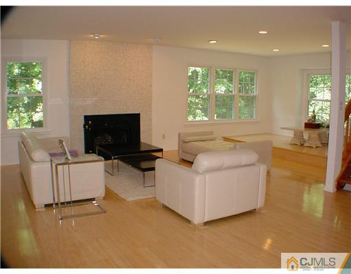 4507 Stonehedge Road Edison, NJ 08820 - Photo 3 of 10 a living room with furniture and a fireplace