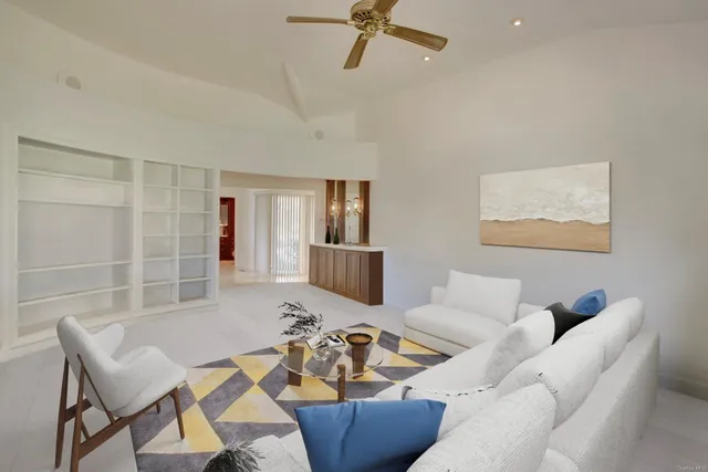 a living room with furniture and a table