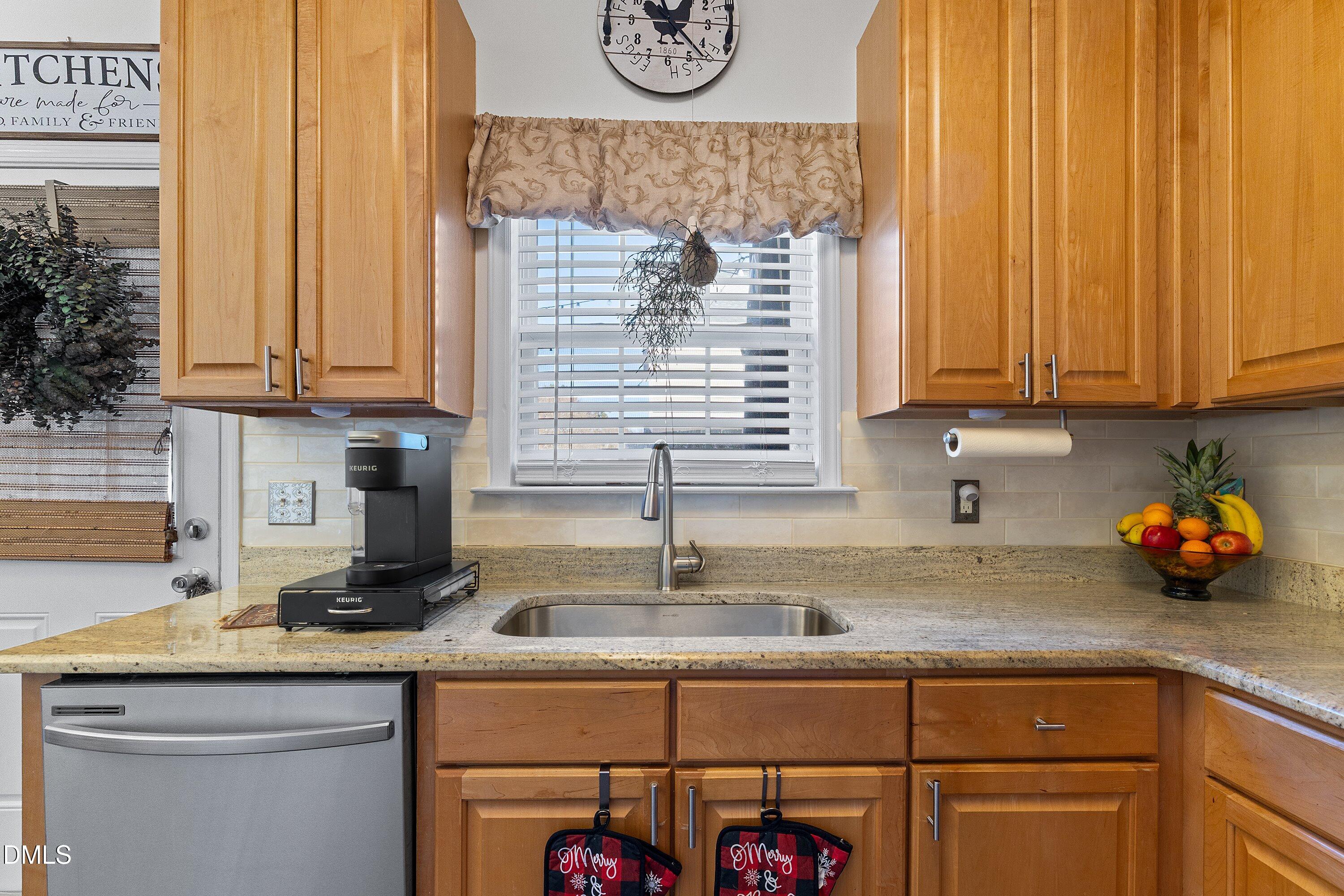 201 Dairy Road Clayton, NC 27520 - Photo 14 of 31 a kitchen with stainless steel appliances granite countertop a sink a cabinets and a counter top space