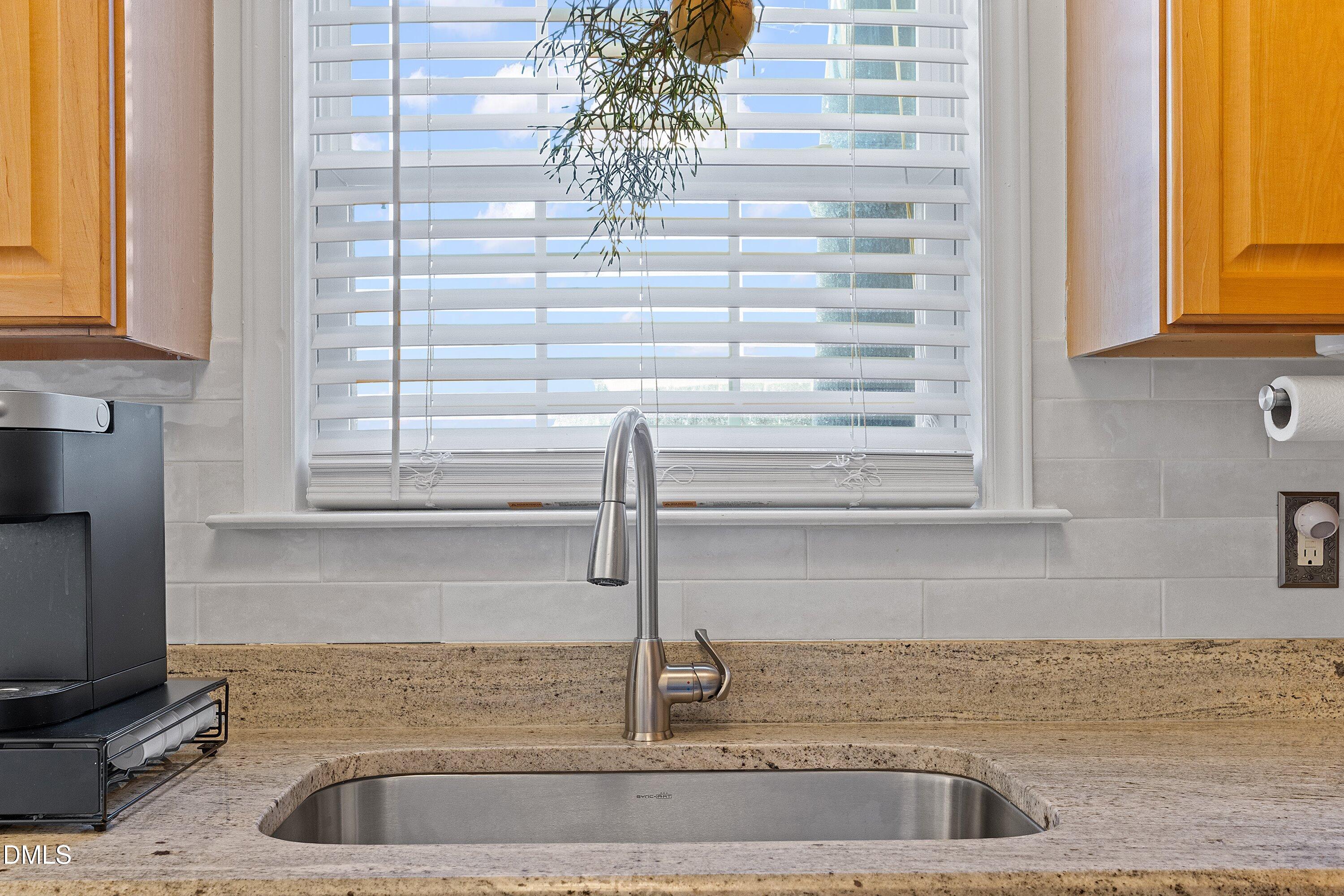 201 Dairy Road Clayton, NC 27520 - Photo 15 of 31 a kitchen with a sink and a window