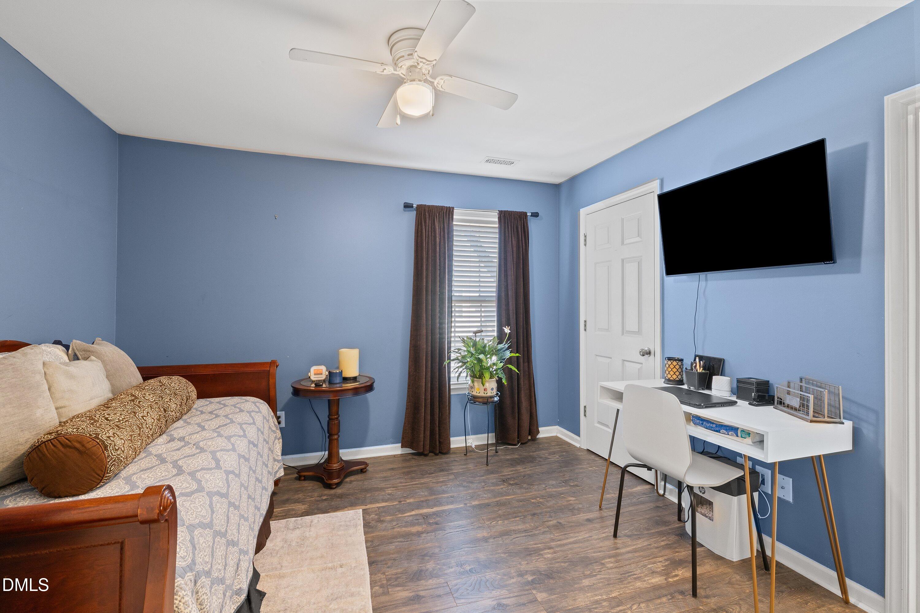 201 Dairy Road Clayton, NC 27520 - Photo 17 of 31 a living room with furniture and a flat screen tv