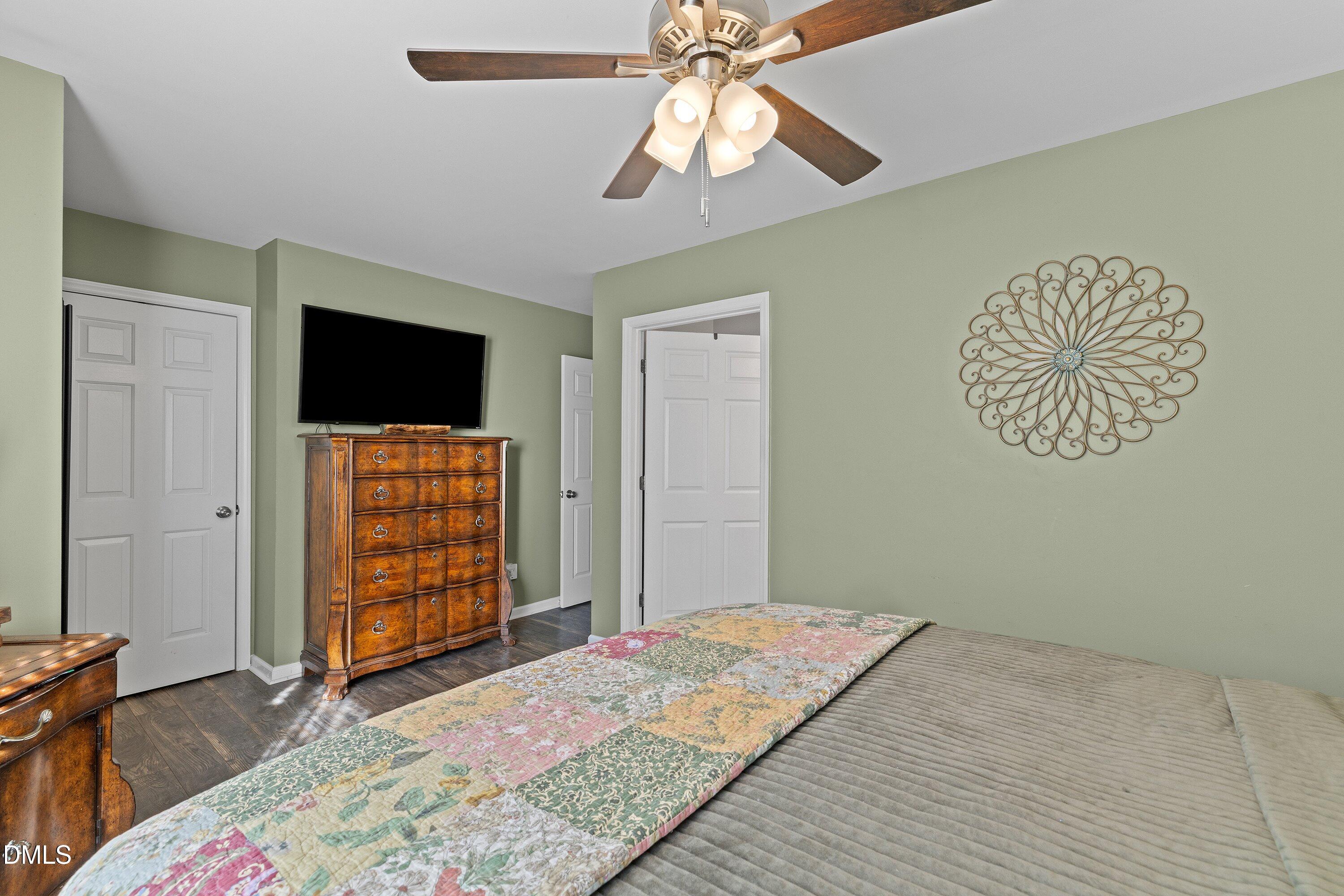 201 Dairy Road Clayton, NC 27520 - Photo 24 of 31 a bedroom with a bed and a television