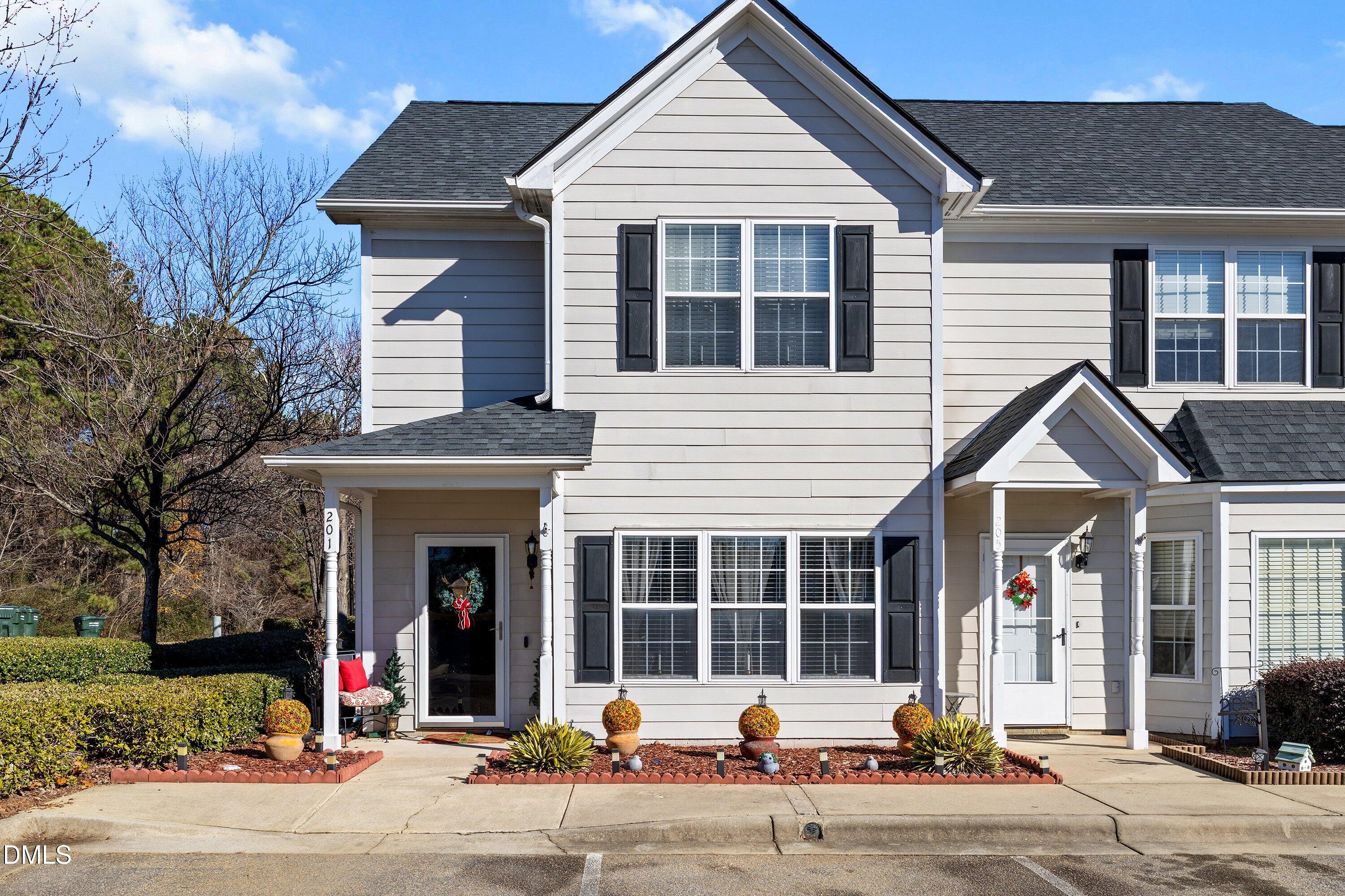 201 Dairy Road Clayton, NC 27520 - Photo 2 of 31 a view of a house with a yard and plants