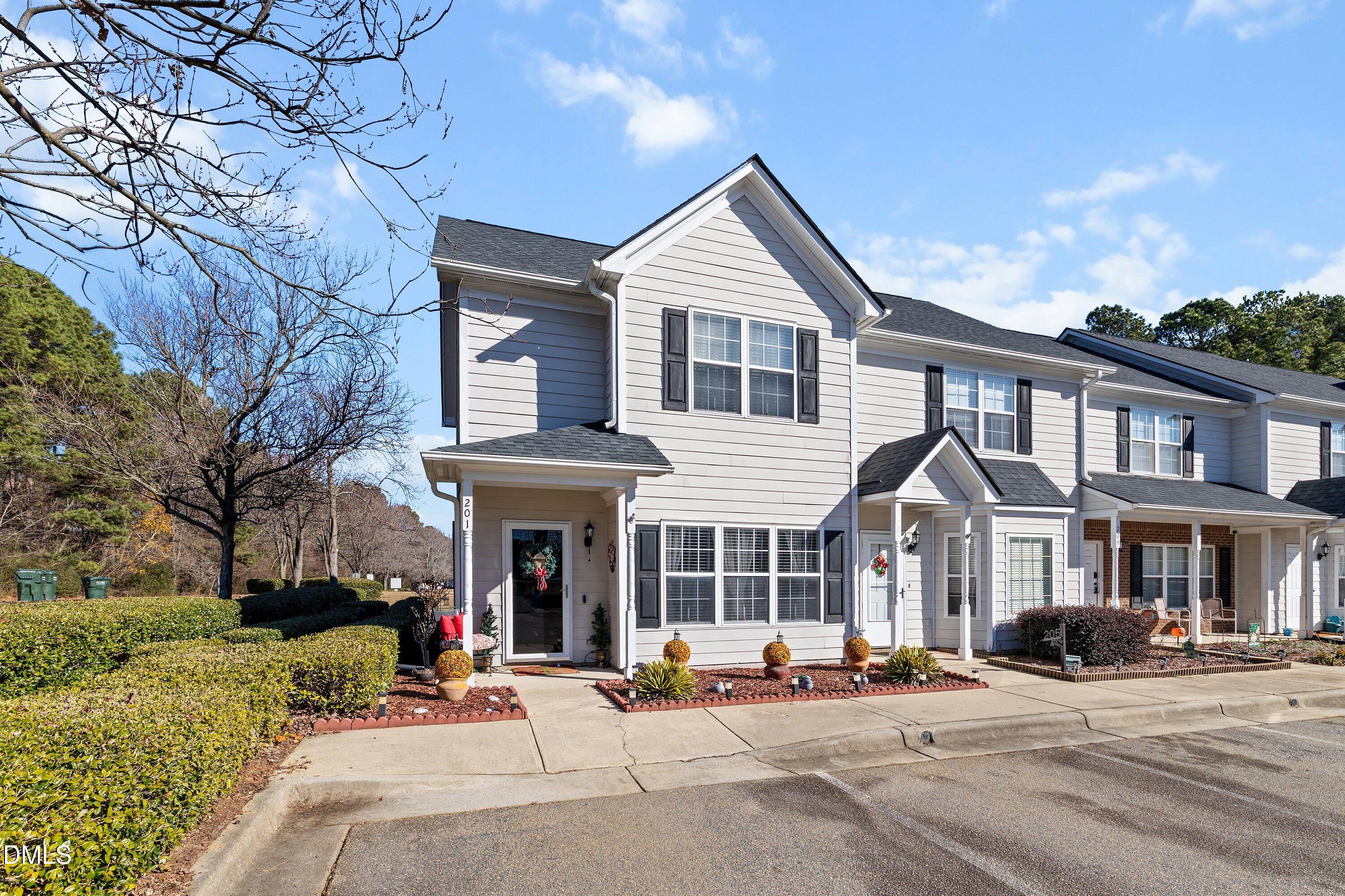 201 Dairy Road Clayton, NC 27520 - Photo 3 of 31 a front view of a building with sitting area