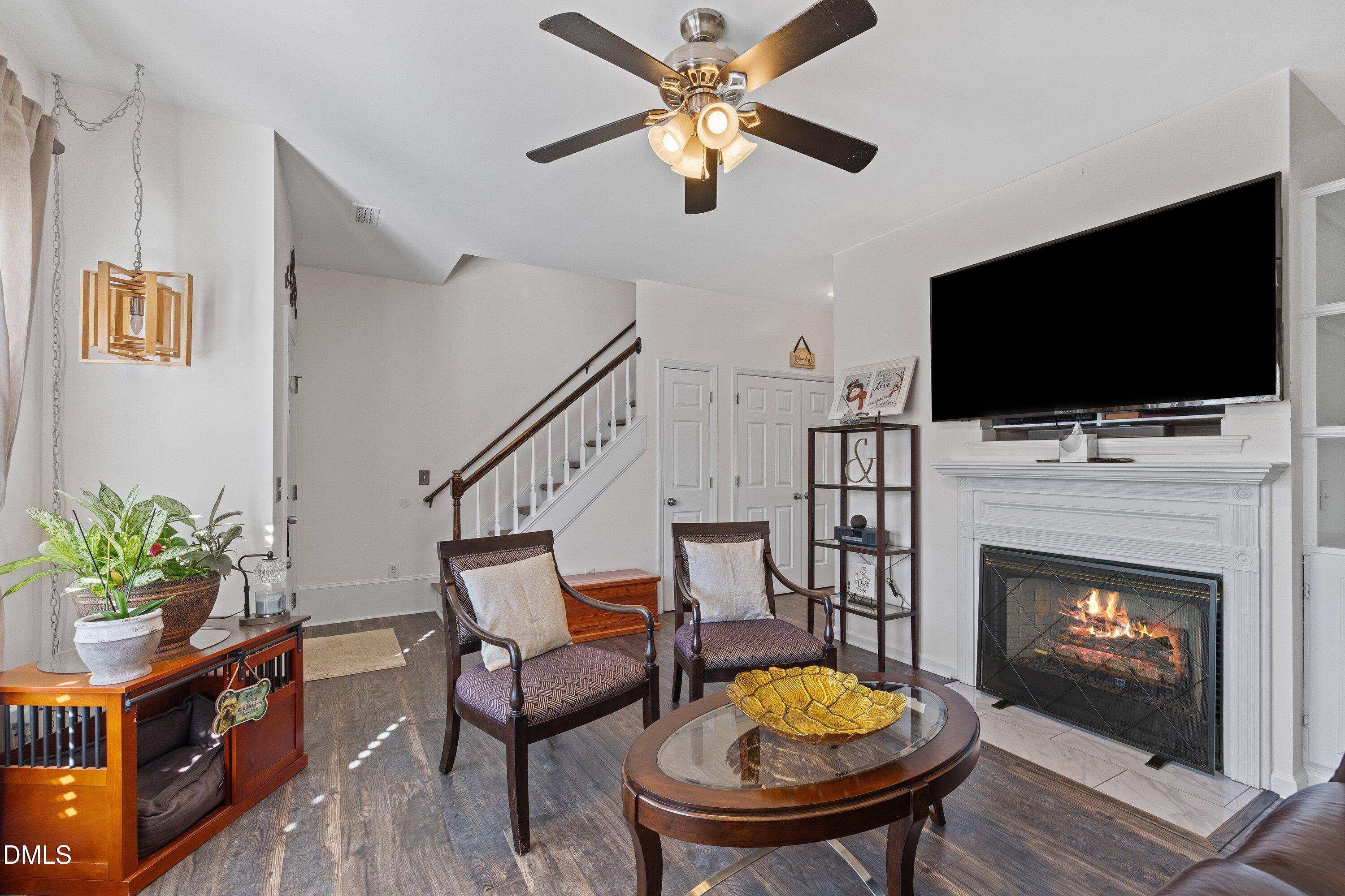 201 Dairy Road Clayton, NC 27520 - Photo 8 of 31 a living room with furniture and a fireplace