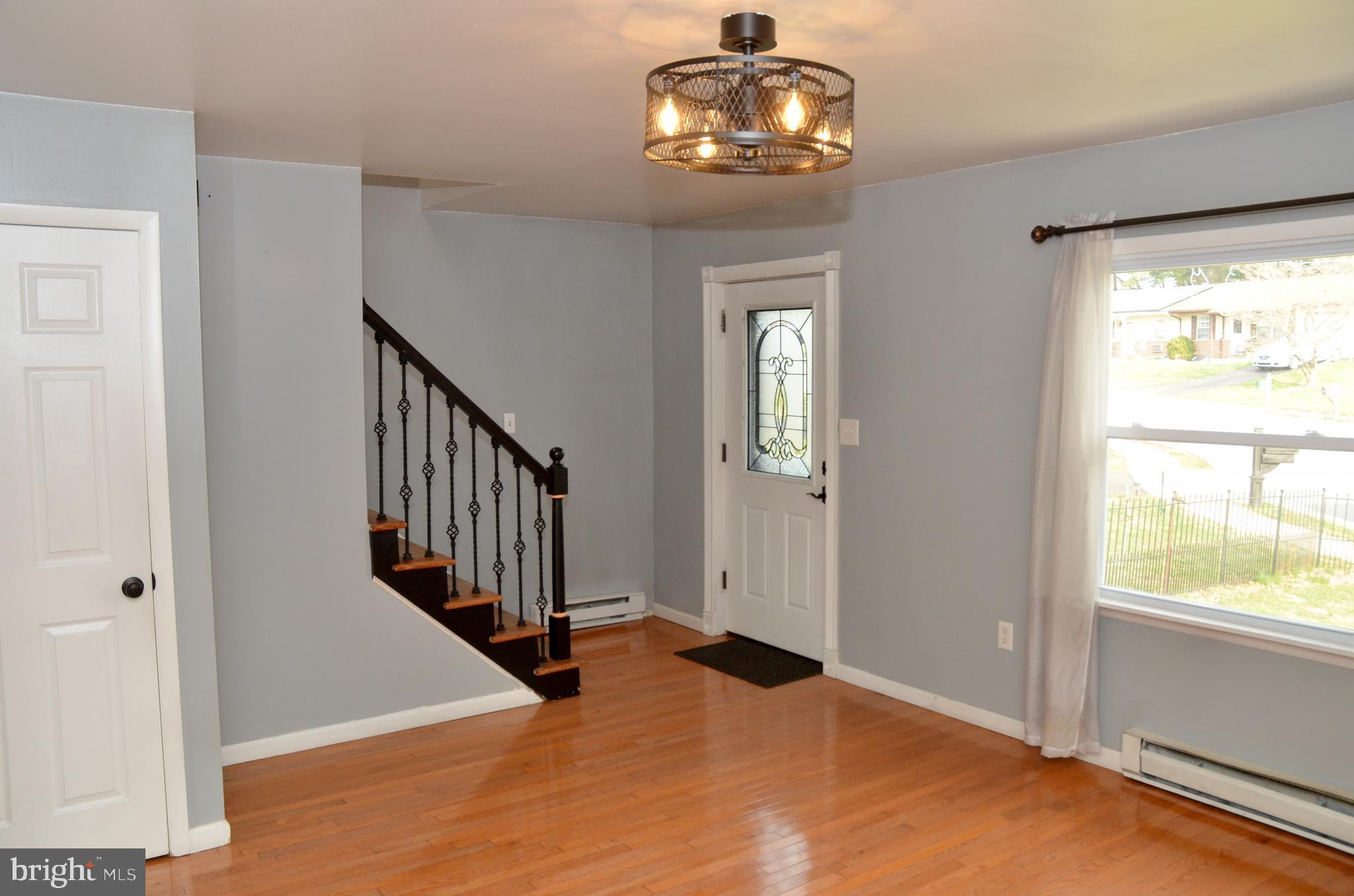 116 Turnbridge Drive Lancaster, PA 17603 - Photo 11 of 41 a view of a livingroom with wooden floor and entryway