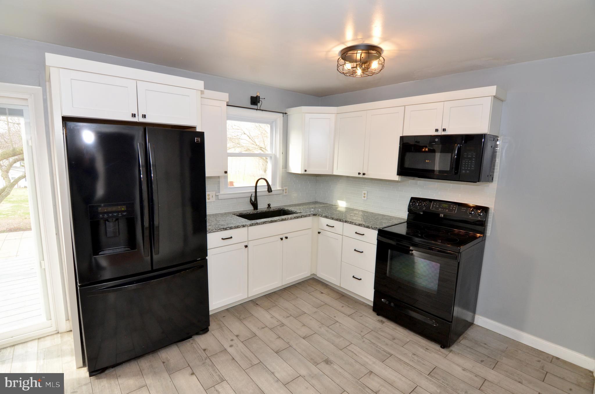 116 Turnbridge Drive Lancaster, PA 17603 - Photo 14 of 41 a kitchen with a refrigerator stove and sink