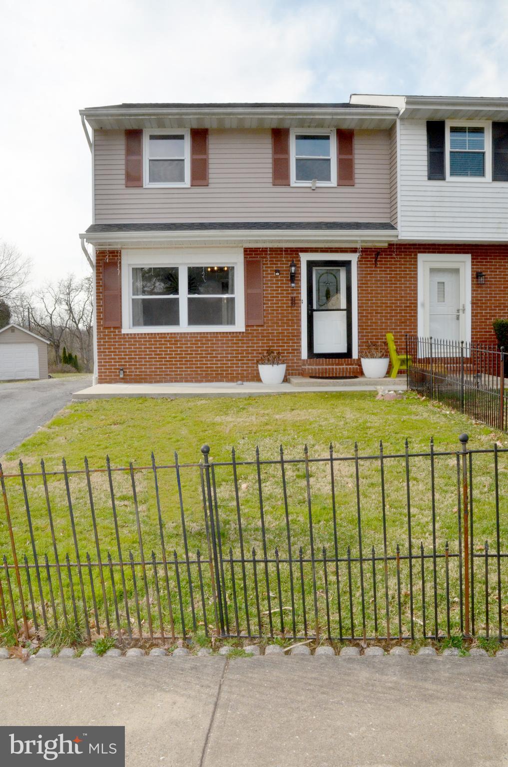 116 Turnbridge Drive Lancaster, PA 17603 - Photo 2 of 41 front view of a brick building with a yard