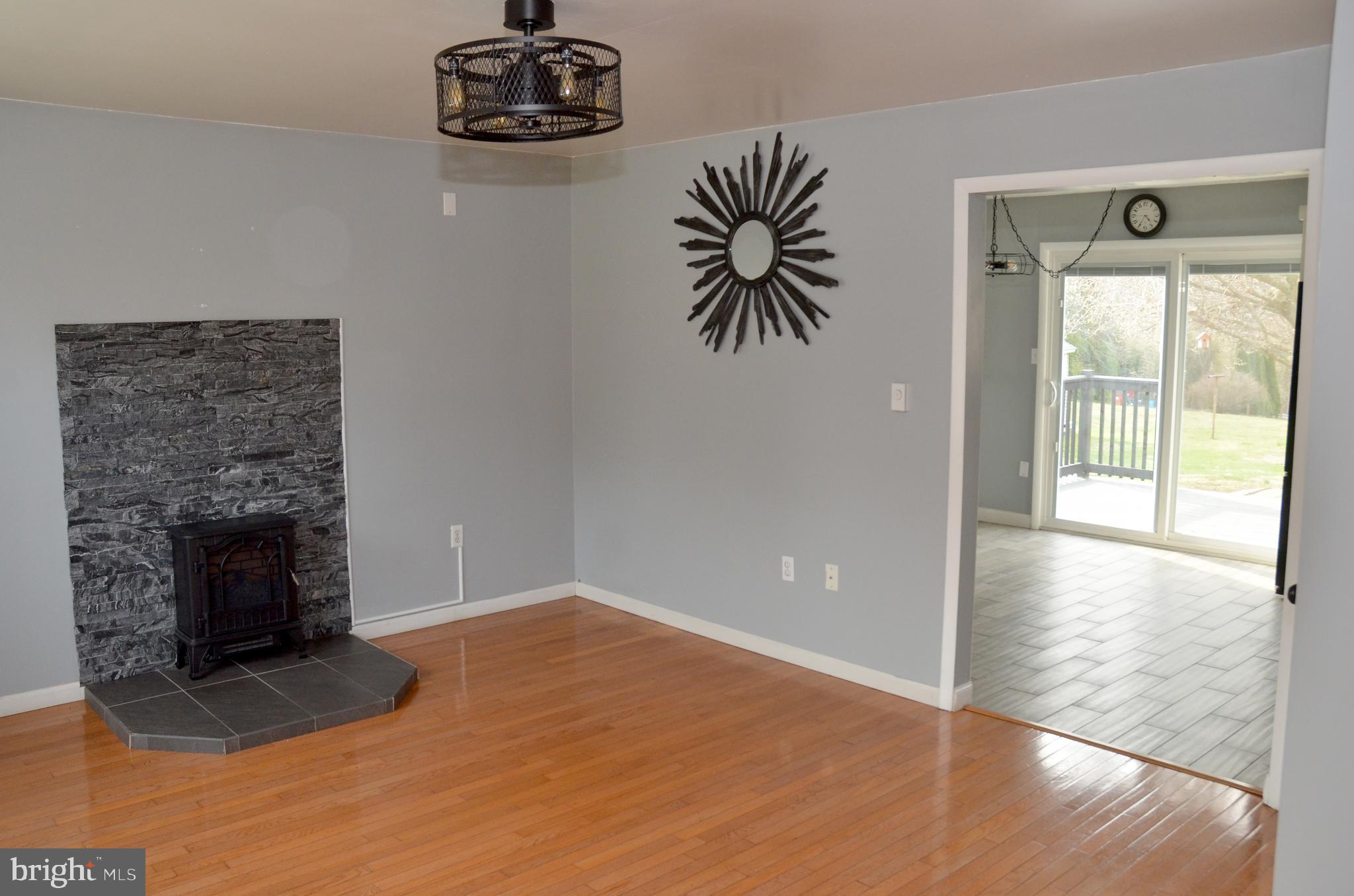 116 Turnbridge Drive Lancaster, PA 17603 - Photo 5 of 41 a view of an empty room with a fireplace and a window