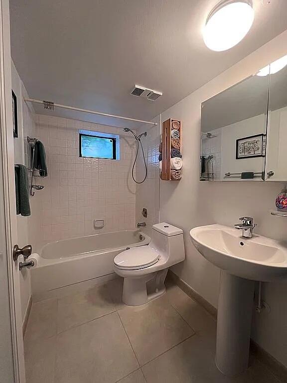 6463 La Costa Drive, Unit 105 Boca Raton, FL 33433 - Photo 18 of 40 a bathroom with a sink a toilet and shower