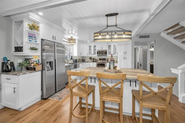 a view of a dinning table and chairs in the patio
