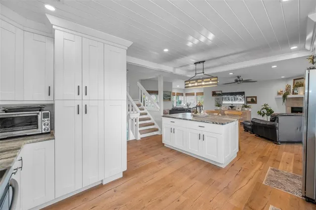 a aerial view of a house with table and chairs