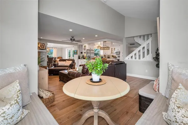 a bedroom with a bed and a ceiling fan