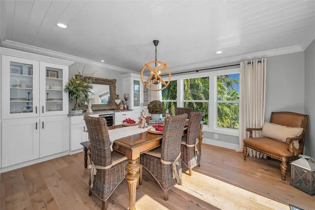 a view of a swimming pool with lounge chairs in patio