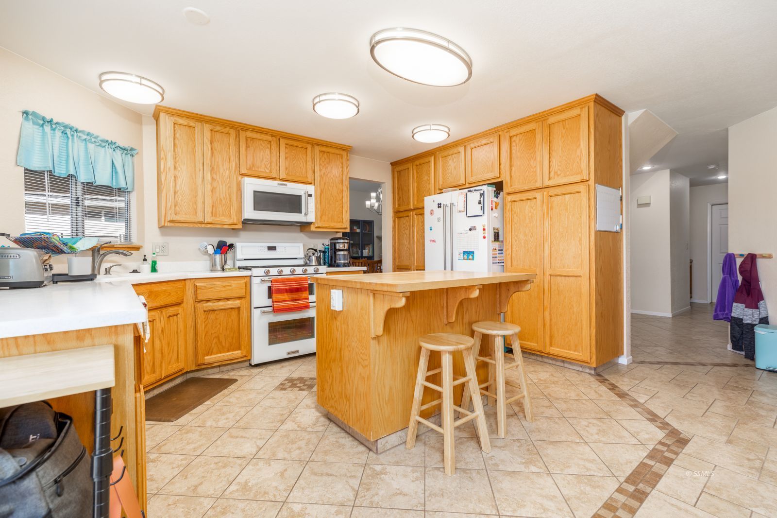 1047 Carolyn Street Ridgecrest, CA 93555 - Photo 9 of 35 a kitchen with a sink cabinets and window