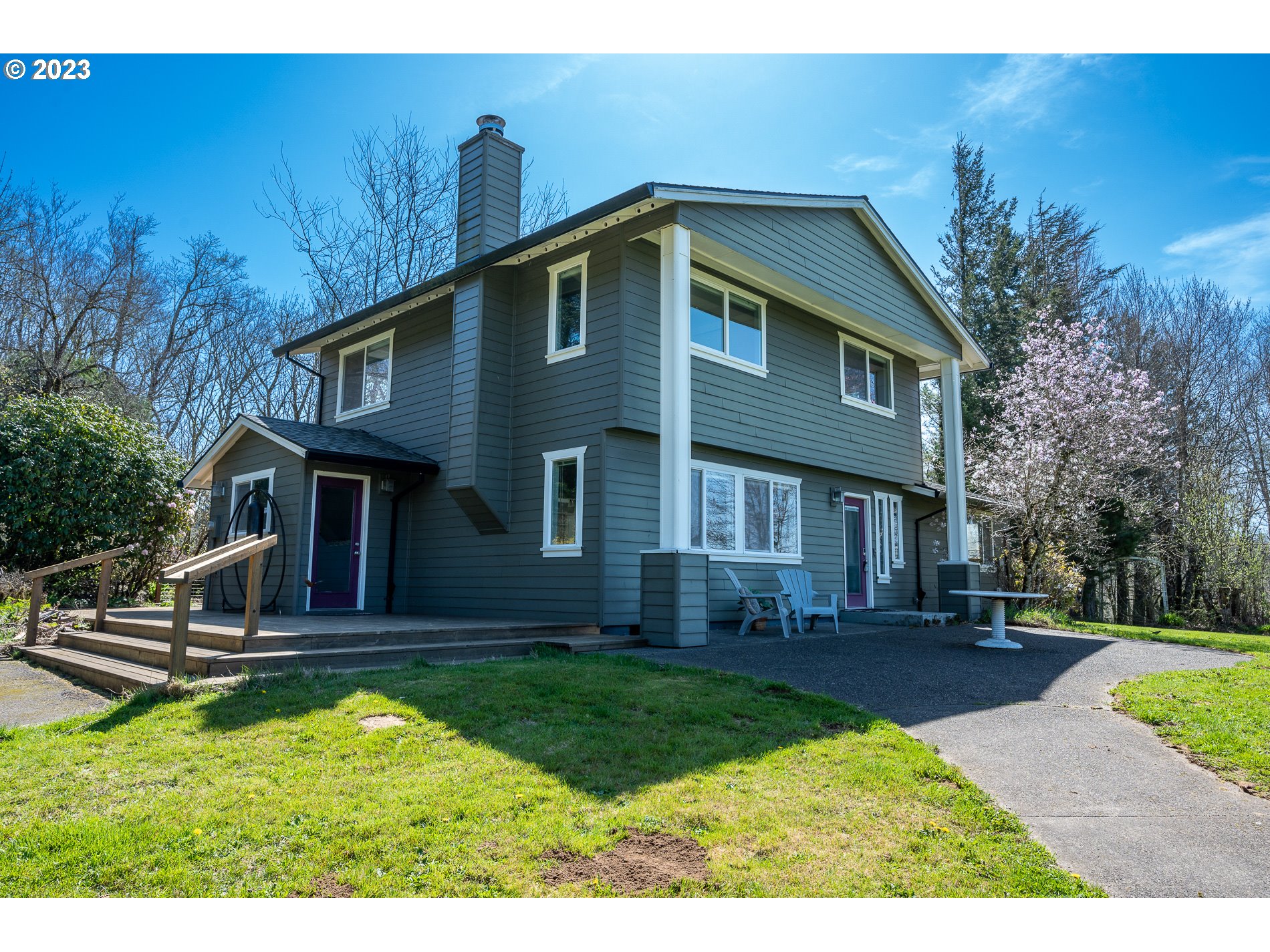930 Northeast Salzman Road Corbett, OR 97019 - Photo 1 of 32 a front view of a house with garden