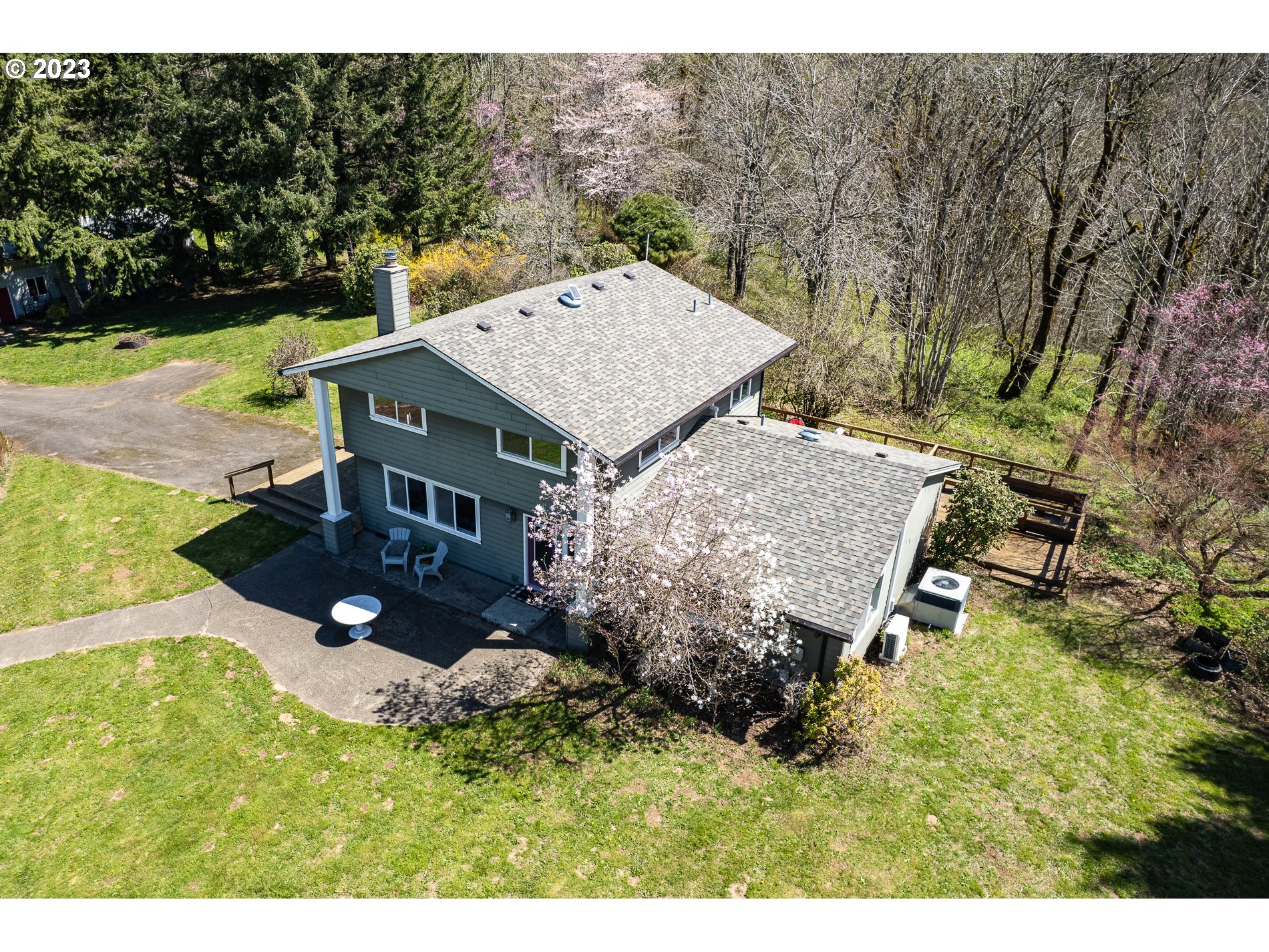 930 Northeast Salzman Road Corbett, OR 97019 - Photo 2 of 32 an aerial view of a house with yard and outdoor seating