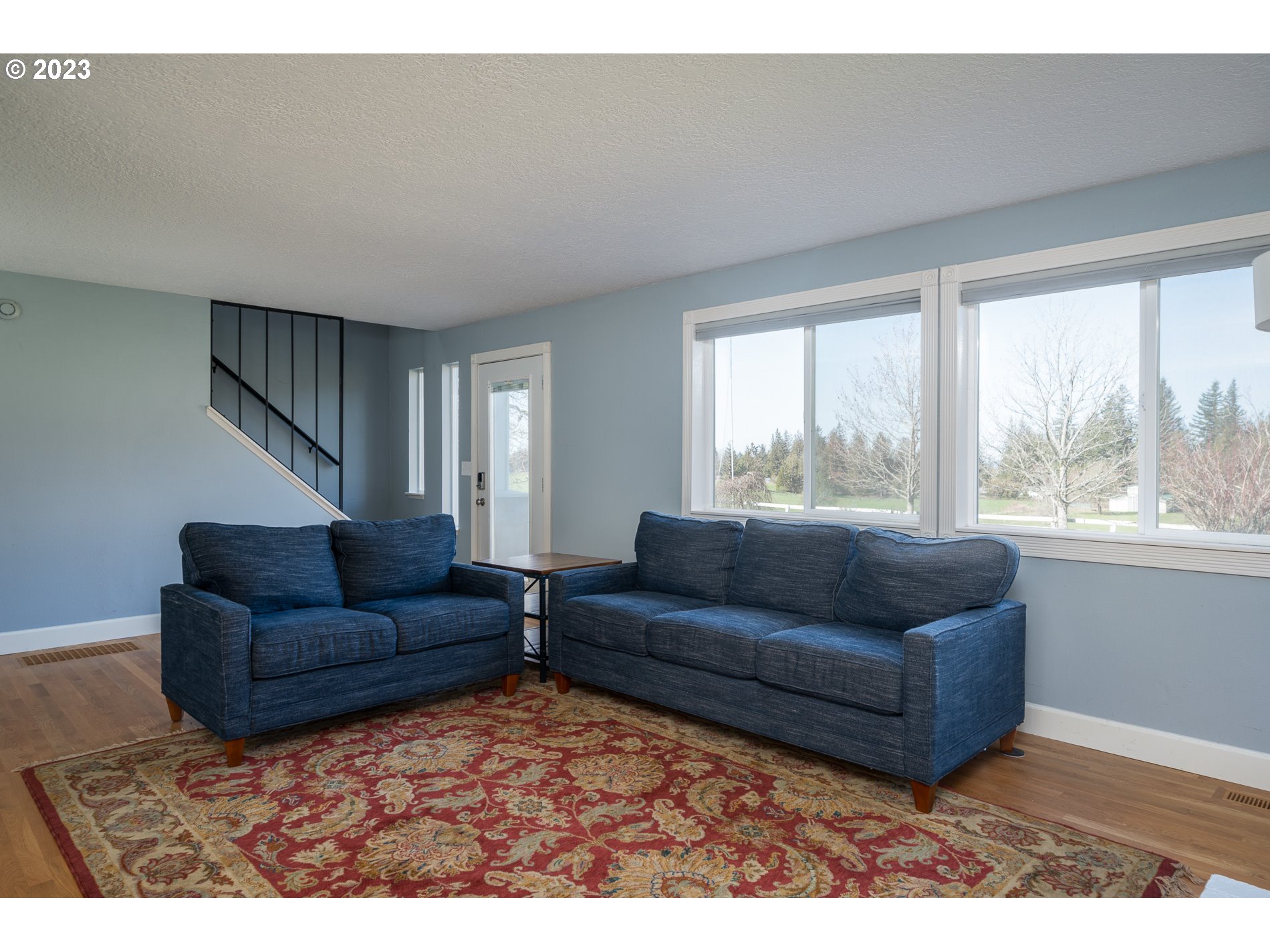 930 Northeast Salzman Road Corbett, OR 97019 - Photo 5 of 32 a living room with furniture and a large window