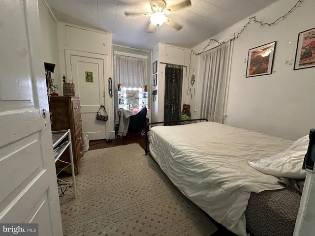 a bed room with a bed and a walk in closet