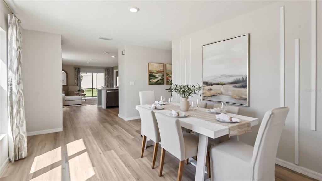 3038 Northeast 21st Ct Road Ocala, FL 34479 - Photo 3 of 21 a view of a dining room with furniture window and wooden floor