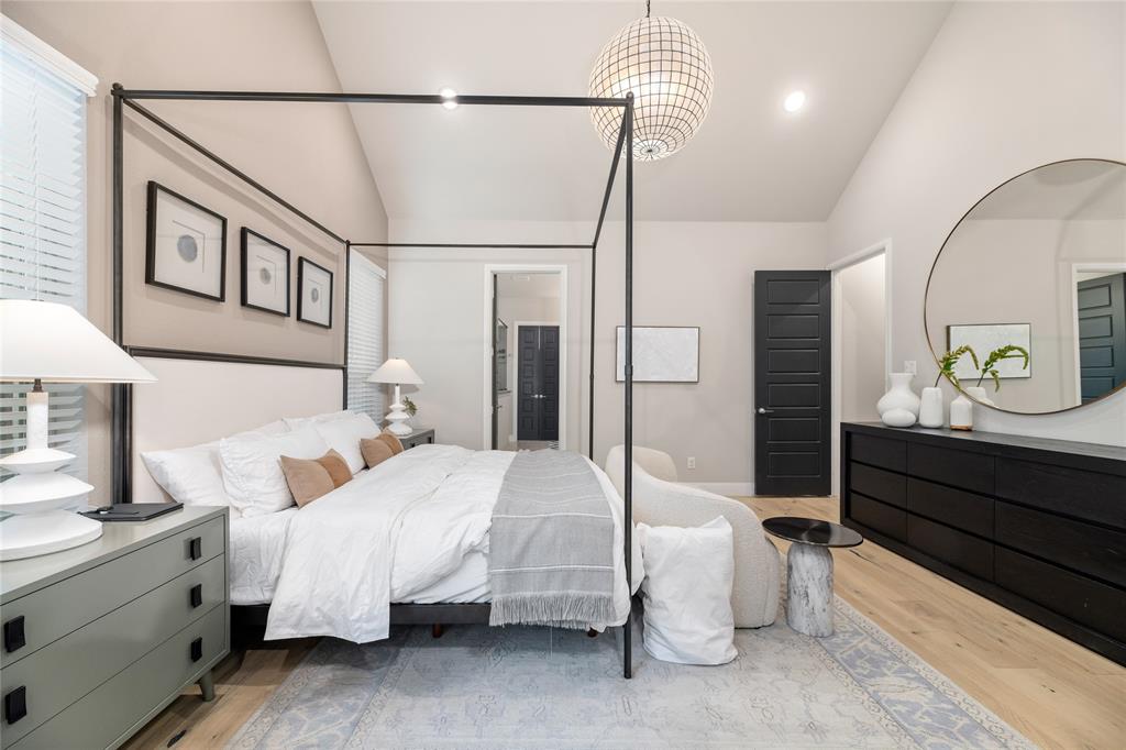 2262 Poppyvine Road Frisco, TX 75033 - Photo 17 of 40 The room features light wood flooring, light-colored walls, and a vaulted ceiling